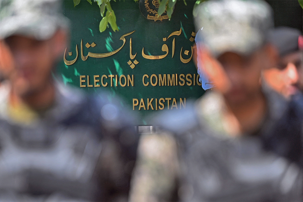 Paramilitary soldiers stand guard outside the Pakistan’s election commission building in Islamabad on August 2, 2022. (AFP/File)