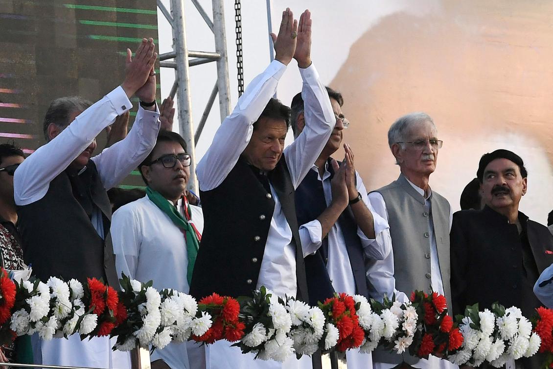 Pakistan's ousted prime minister Imran Khan, center, gestures upon his arrival to address the supporters of his Pakistan Tehreek-e-Insaf (PTI) party at a rally in Islamabad on March 27, 2022. (AFP/File)