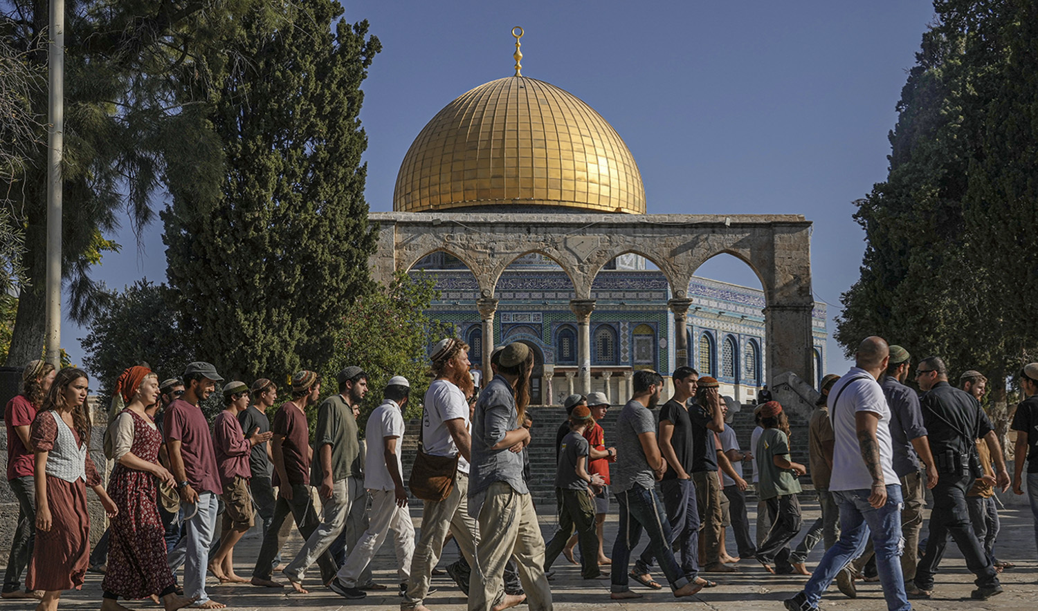 Israeli settlers enter the Al-Aqsa Mosque compound in the Old City of Jerusalem on August 7, 2022. (AP)