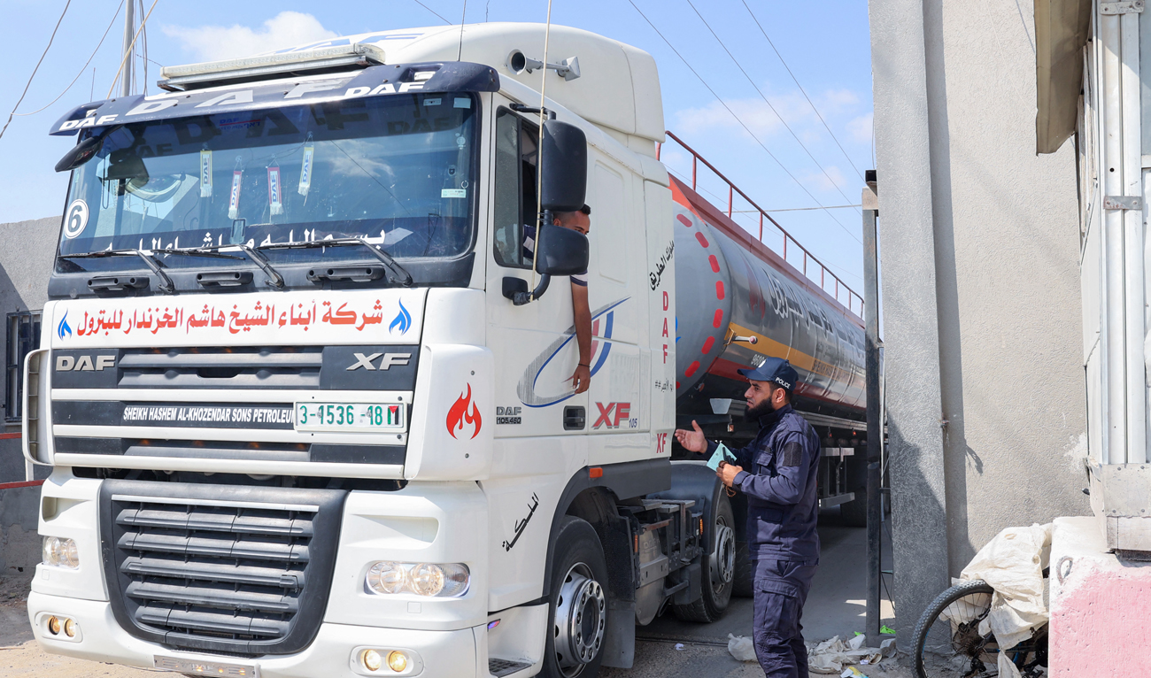 A fuel truck enters the Gaza Strip through the Kerem Shalom crossing with Israel, in Rafah in the southern Palestinian enclave following a truce, on August 8, 2022. (AFP)
