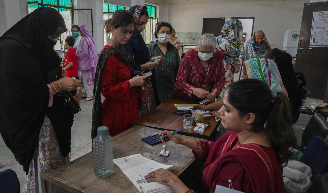 Voters arrive to cast their ballot at a polling station during the by-election in Punjab province assembly seat in Lahore on July 17, 2022. (AFP/File)