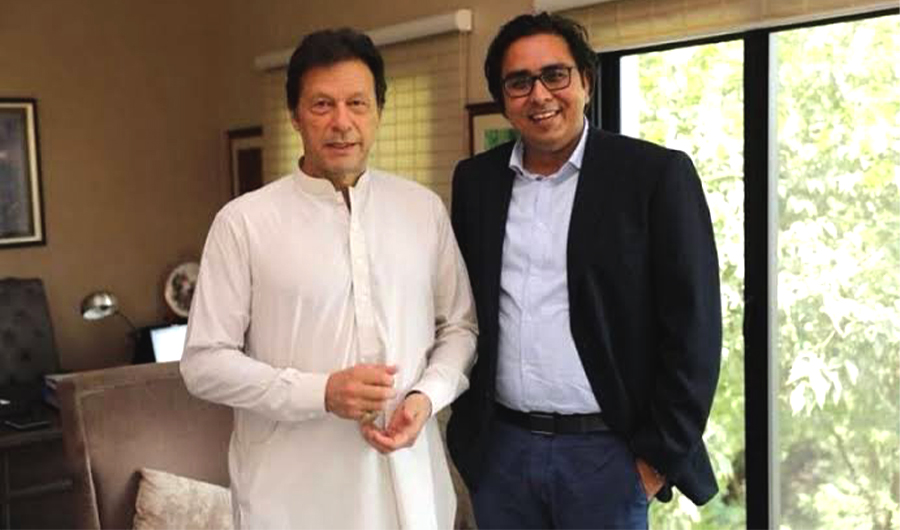 In this photo, former Pakistan prime minister Imran Khan (L) and his chief of staff, Dr. Shahbaz Gill pose for a photo at Banigala, Islamabad. (@DrMuradPTI/Twitter)