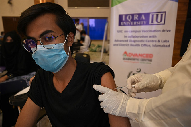 A student receives a dose of the CanSino Biologics' Covid-19 coronavirus vaccine at a university in Islamabad on June 28, 2021. (AFP)