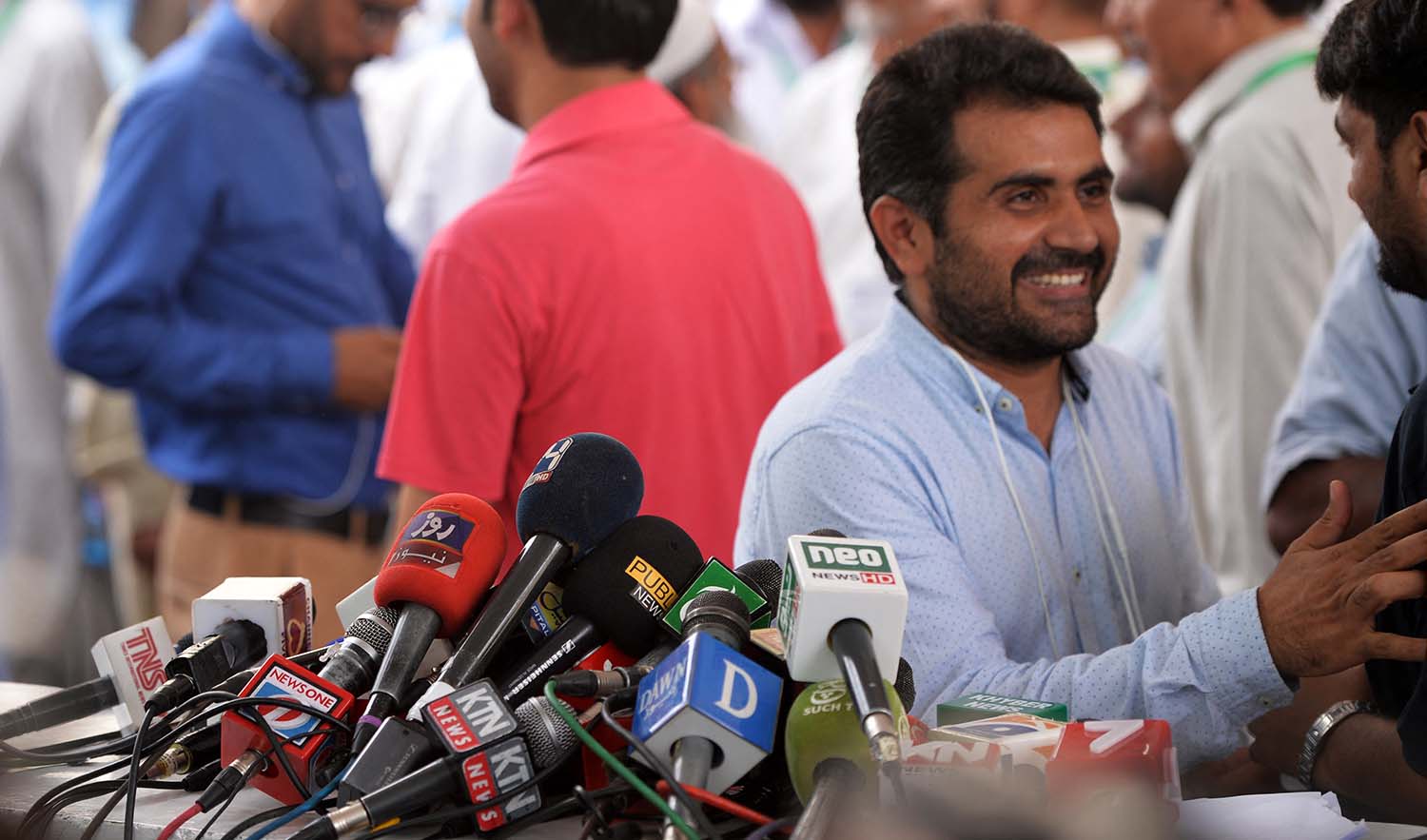 Pakistani journalists gather before a press conference outside the Supreme Court building, in Islamabad, Pakistan, on June 28, 2018. (AFP/File)