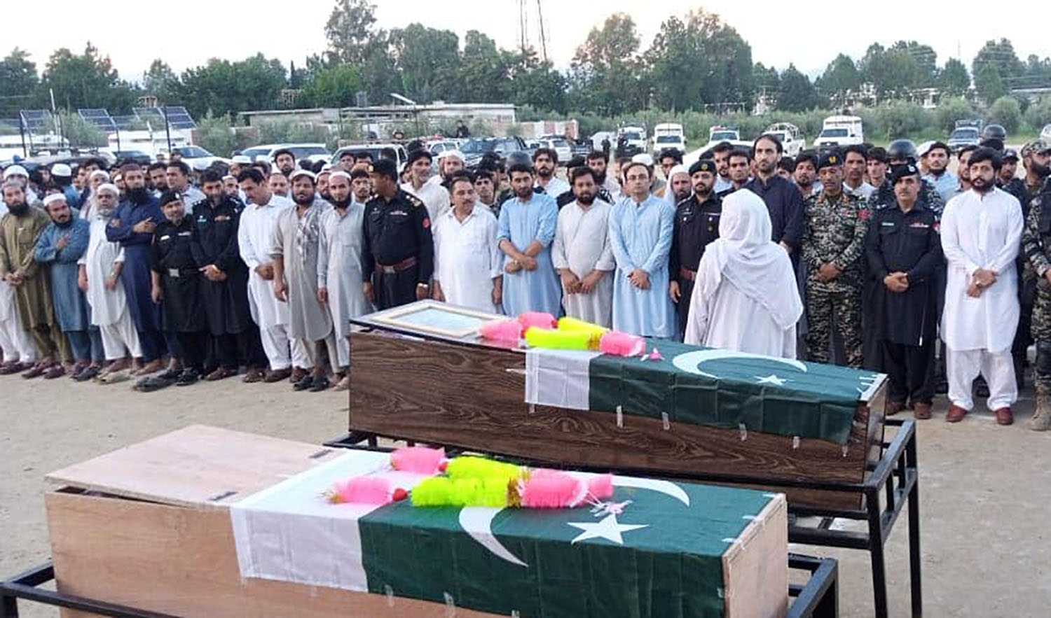 Funeral prayers in process for the two policemen who lost their lives in a bomb explosion in Bajaur district of Pakistan's Khyber Pakhtunkhwa province on August 19, 2022. (Photo courtesy: @DistrictPoliceOfficerBajaur/Facebook)