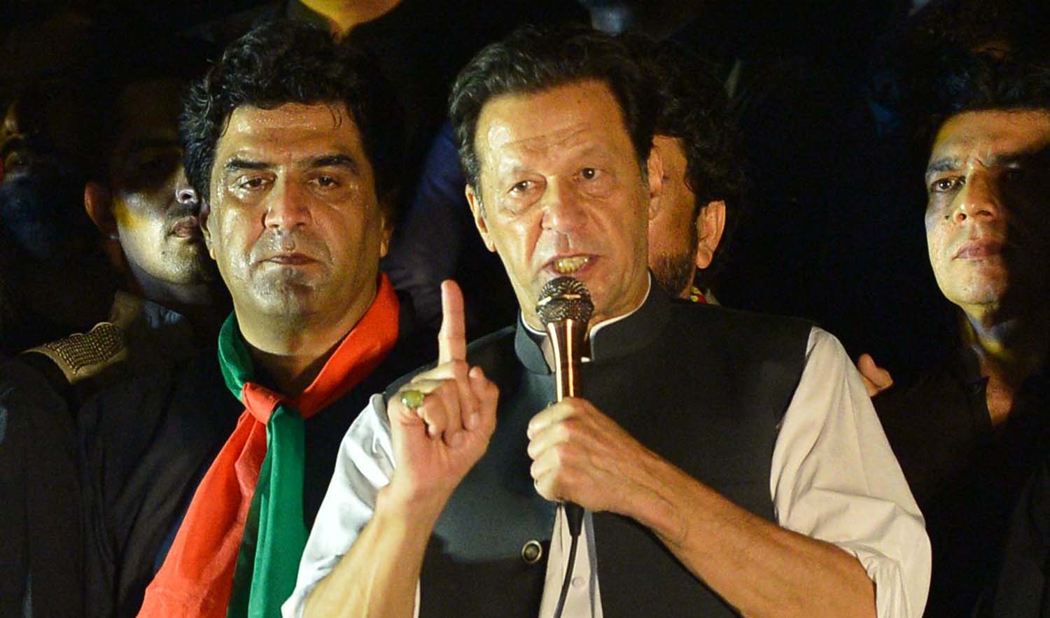 Pakistan's former Prime Minister and leader of the Pakistan Tehreek-e-Insaf party (PTI) Imran Khan, speaks during an anti-government protest rally in Islamabad on August 20, 2022. (AFP)