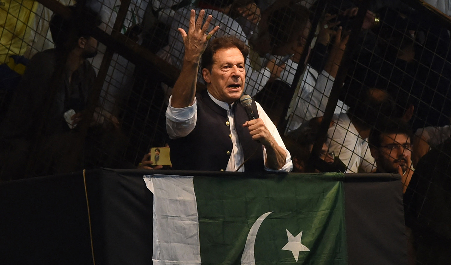 Pakistan's former Prime Minister Imran Khan delivers speech to his supporters during a rally to celebrate the 75th anniversary of Pakistan's independence day in Lahore on August 13, 2022. (AFP)