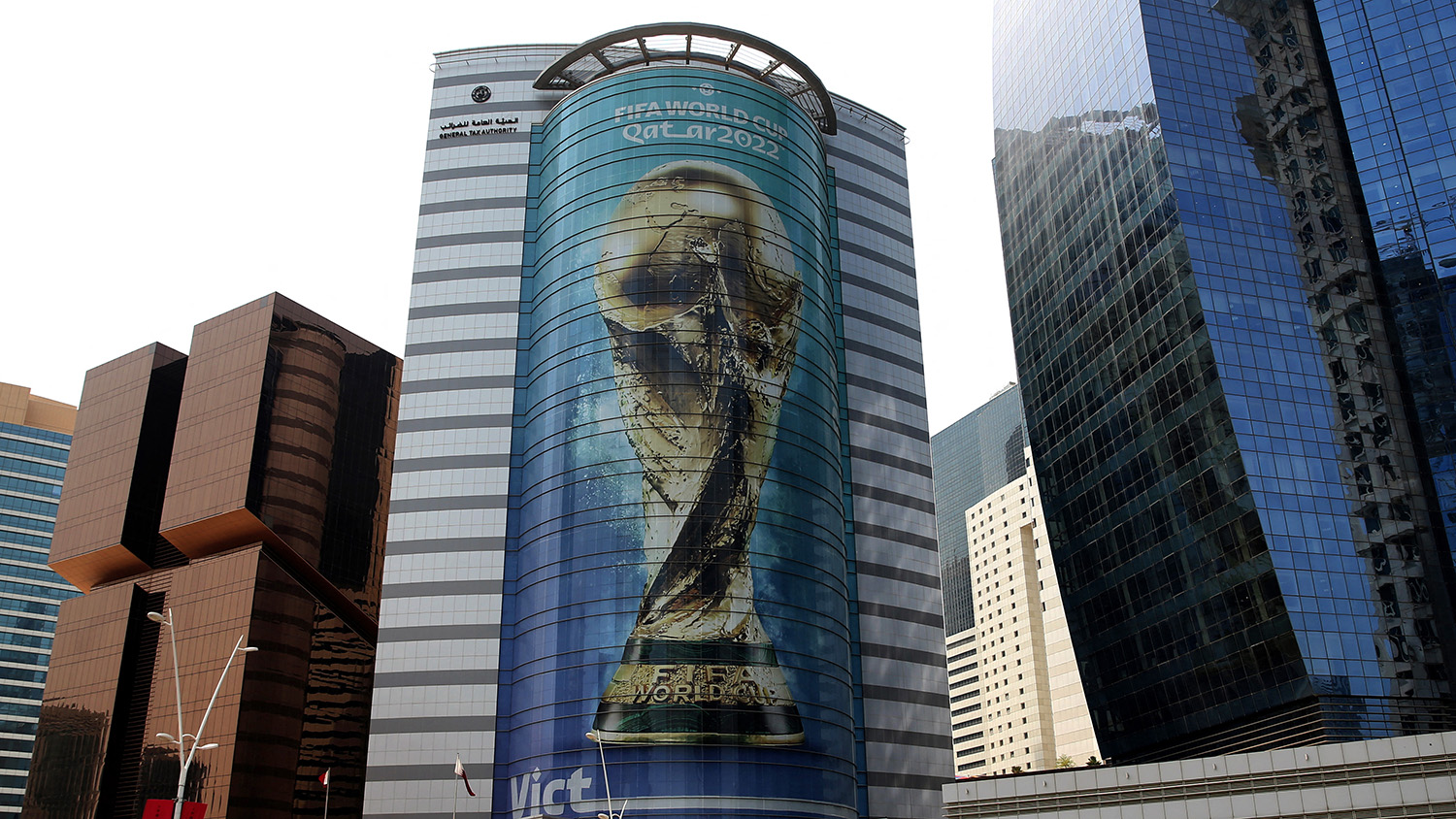 An image of the FIFA 2022 World Cup trophy adorns a building in the Qatari capital Doha on August 16, 2022. (AFP)