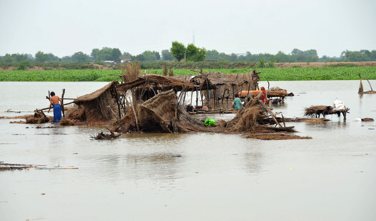 Villagers search for their belongings after their huts were destroyed in flood waters in Jaffarabad district of Balochistan province on August 22, 2022. (AFP/File)