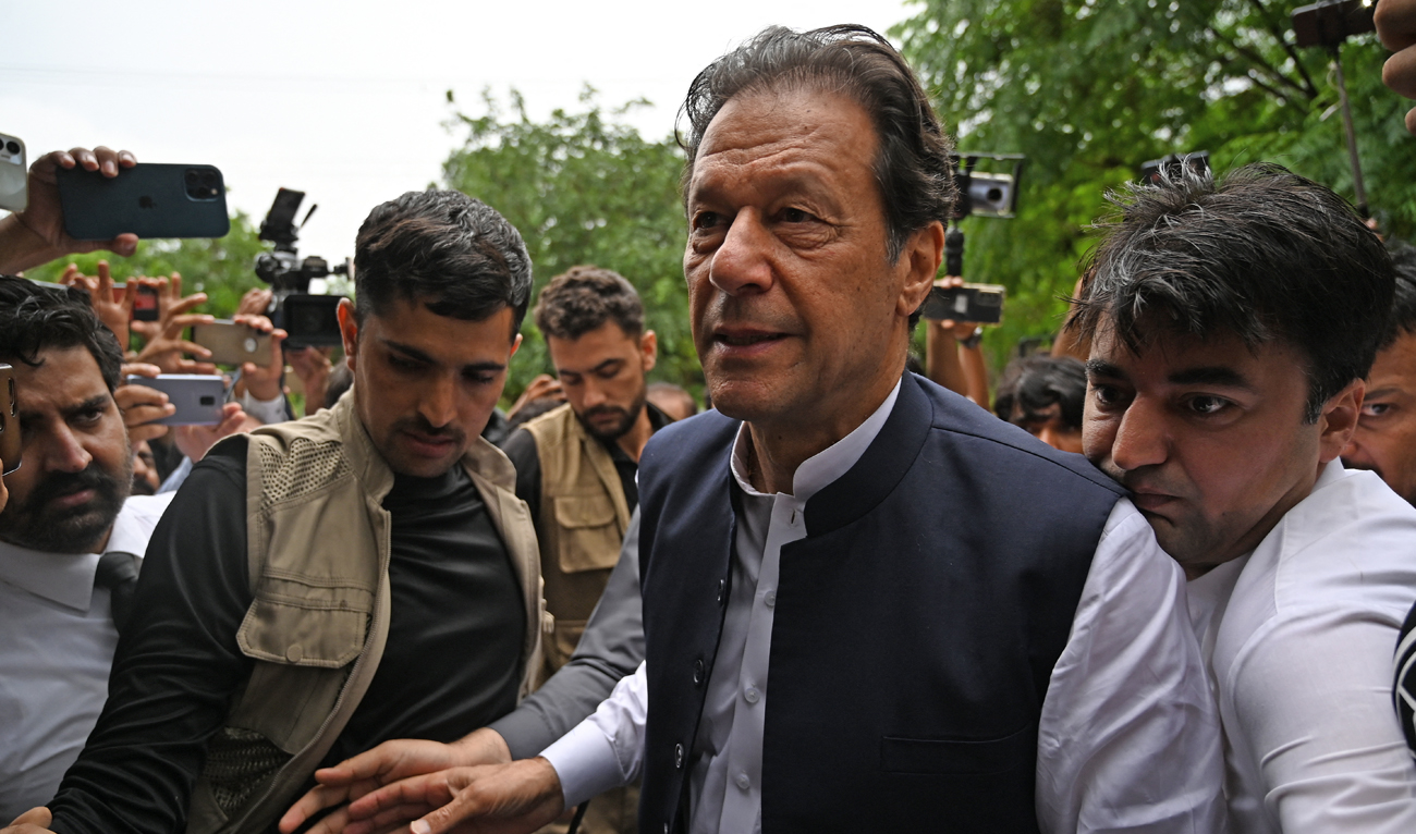 Pakistan's former prime minister Imran Khan (C) arrives before an anti-terrorist court in Islamabad on August 25, 2022. (AFP)