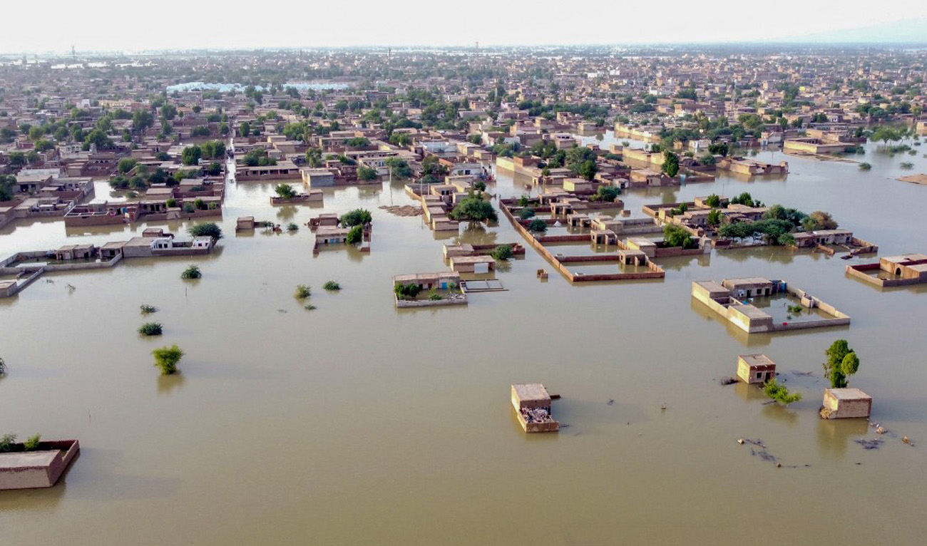 This aerial view shows a flooded residential area after heavy monsoon rains in Balochistan province on August 29, 2022. (AFP)