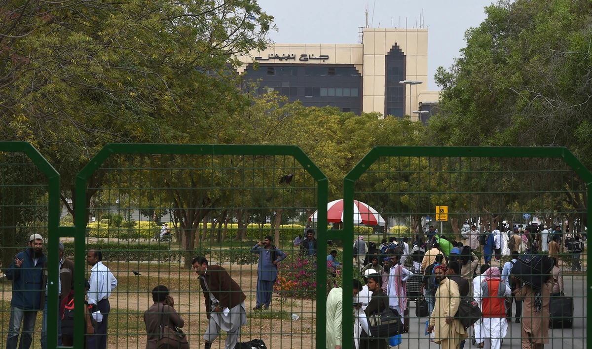 Pakistani passengers gather outside the Jinnah International Airport as they wait for flight operations to resume in Karachi on March 1, 2019. (AFP/File)