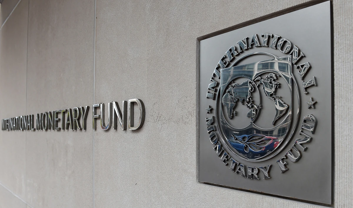 An exterior view of the building of the International Monetary Fund (IMF), with the IMG logo, is seen on March 27, 2020 in Washington, DC. (AFP/File)