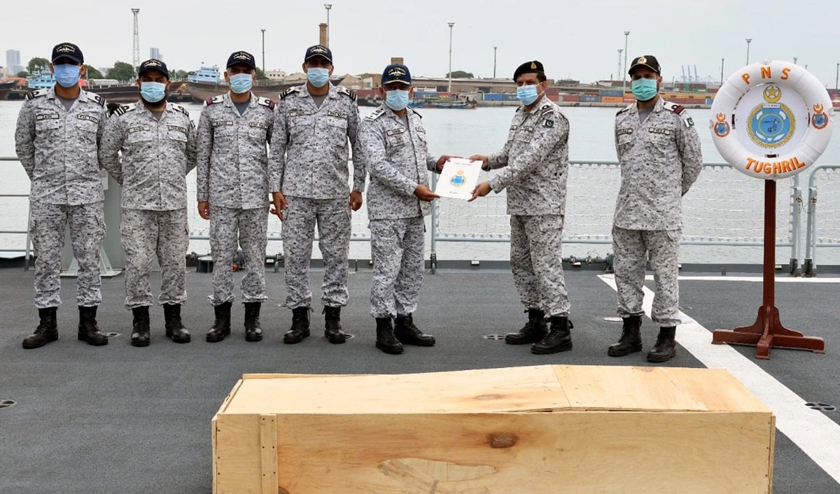 Pakistan Navy hands over the dead body of a crew member of sunken Indian vessel 'Jamna Sagar' to PMSA authorities on August 11, 2022. (Photo courtesy: @PakistanNavy/Facebook)