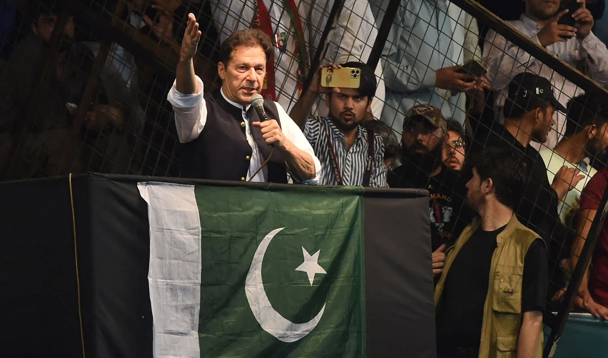 Pakistan's former Prime Minister and Pakistan Tehreek-e-Insaf party (PTI) chief Imran Khan, delivers a speech to his supporters during a rally celebrate the 75th anniversary of Pakistan's independence day in Lahore on August 13, 2022. (AFP)