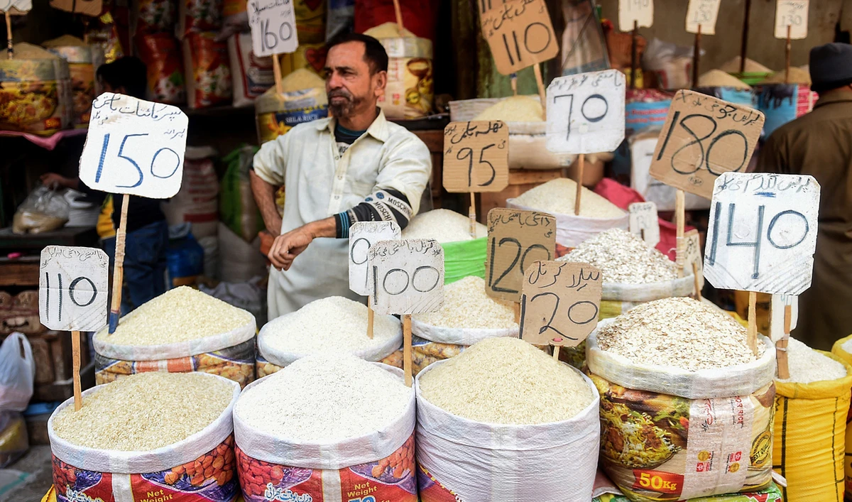 In this picture taken on January 10, 2022, a shopkeeper waits for customers at a market in Karachi. (AFP/File)