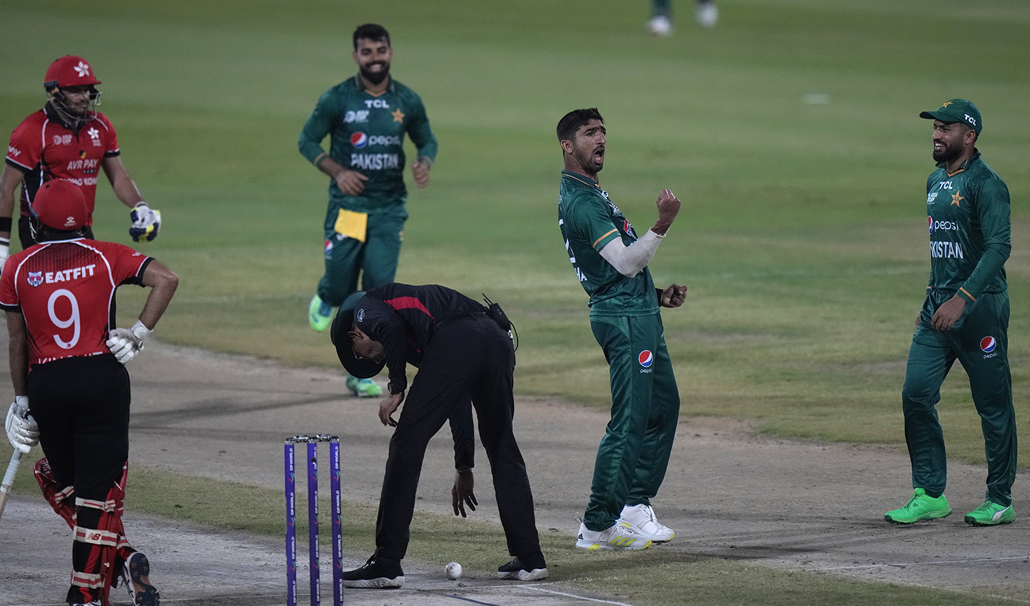 Pakistan's Shahnawaz Dahani, second right, celebrates after taking the wicket of Hong Kong's Yasim Murtaza during the T20 cricket match of Asia Cup between Pakistan and Hong Kong, in Sharjah, UAE, on September 2, 2022. (AP)