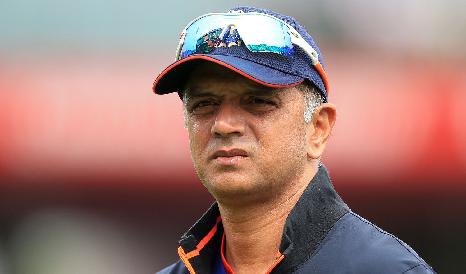 India's head coach Rahul Dravid wathces his players warm up ahead of the final one-day international (ODI) cricket match between England and India at Old Trafford in Manchester on July 17, 2022. (AFP)