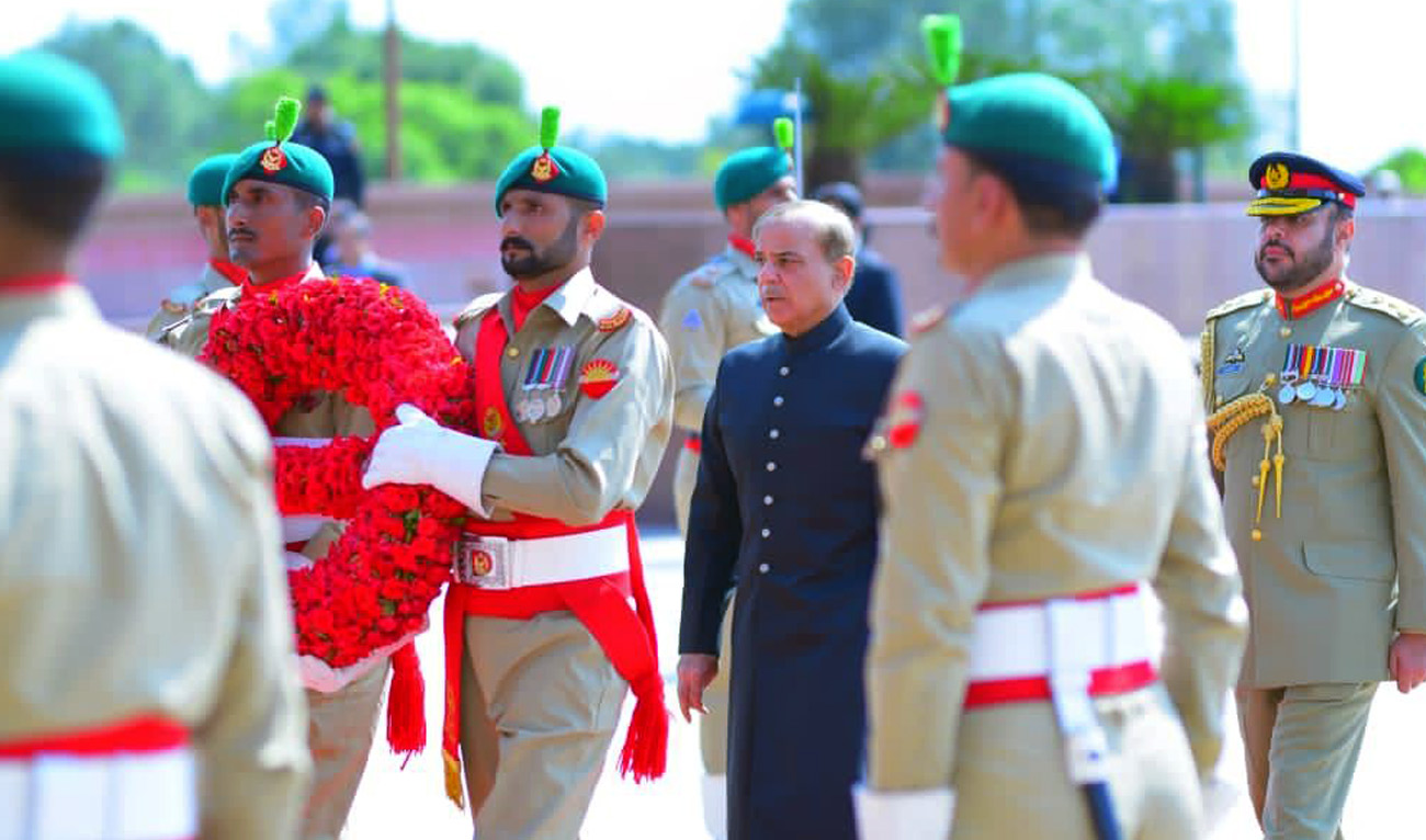 Pakistan Prime Minister Shehbaz Sharif lays floral wreath at Yadgar-e-Shuhada to mark the country's Defence Day, paying tributes to the soldiers of the armed forces at Pakistan Monument in Islamabad on September 6, 2022. (Twitter/PMLN)