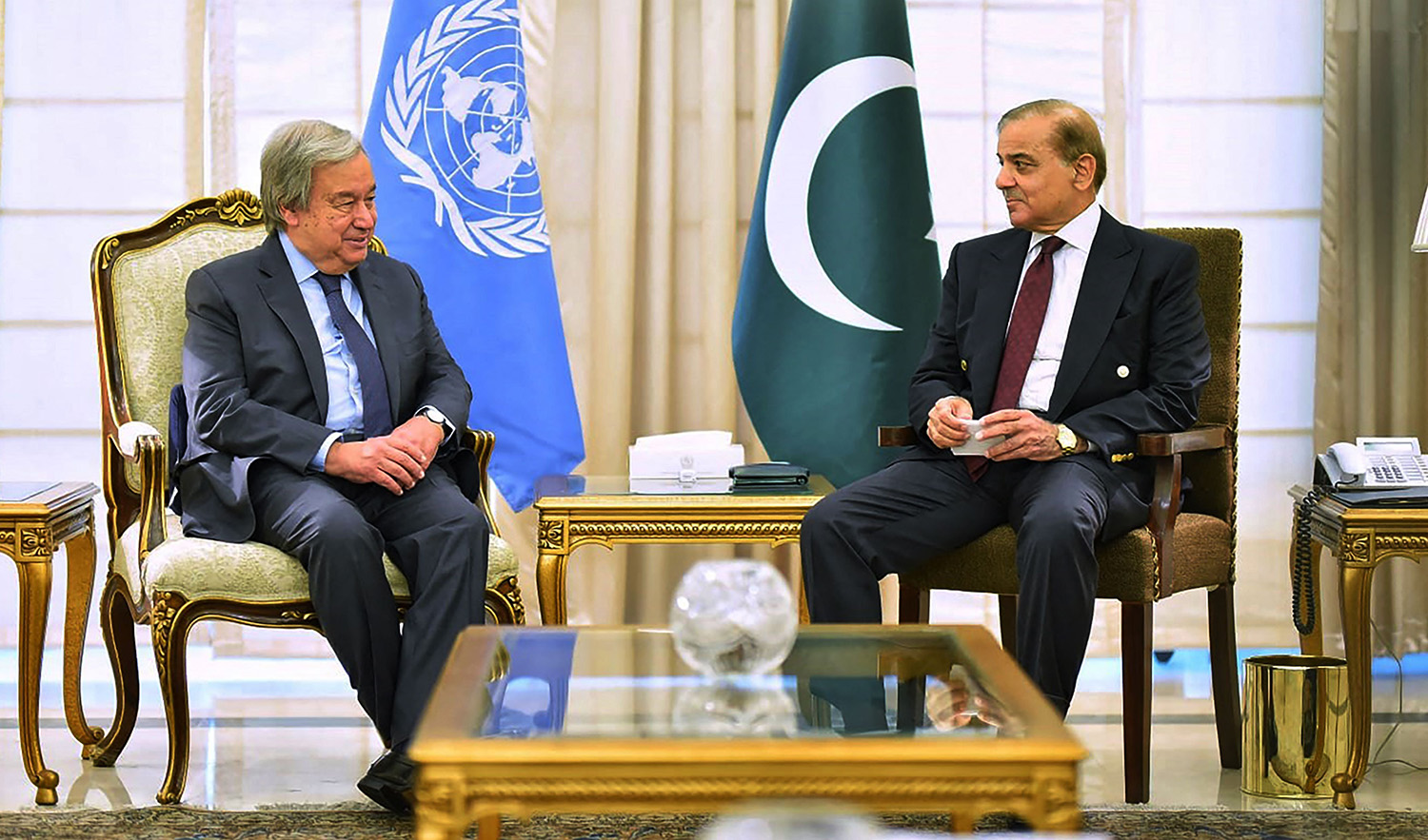 Pakistan Prime Minister Shahbaz Sharif (R) talking with United Nations Secretary General Antonio Guterres during a metting at the Prime Minister house in Islamabad on September 9, 2022. (PID)