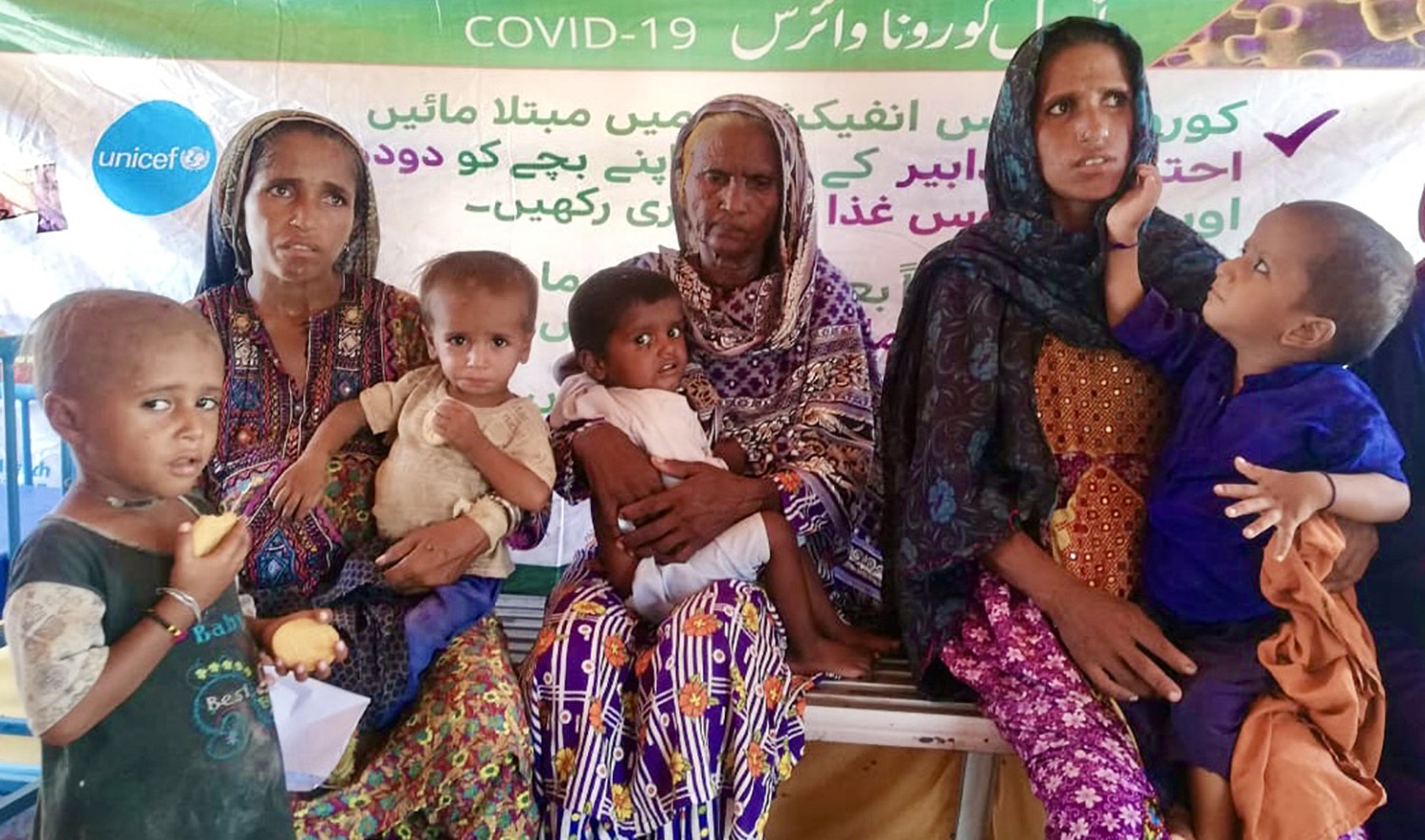 Women awaiting their turn for check-up of their children at a shelter camp in Usta Mohammad, Pakistan on September 10, 2022. (AN photo)