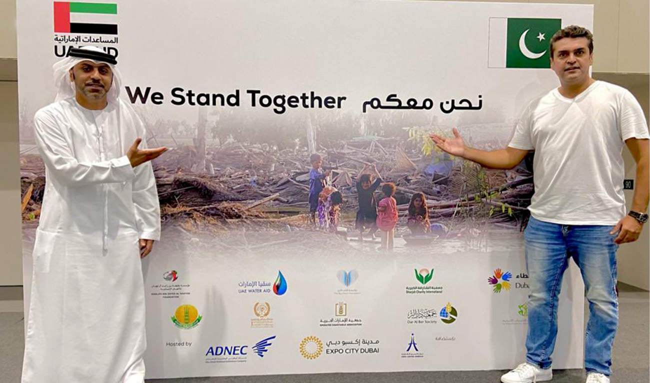 United Arab Emirates Ambassador Hamad Alzaabi poses with Pakistani actor and social activist Fakhre Alam as he collects food and other relief items for flood-affected people in Islamabad, Pakistan from UAE on September 12, 2022. (Twitter/uaeembassyisb)