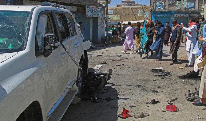 Police and residents gather at the site after a bomb blast in the Pakistan-Afghanistan border town of Chaman, Pakistan, on May 21, 2021. (REUTERS/FILE)