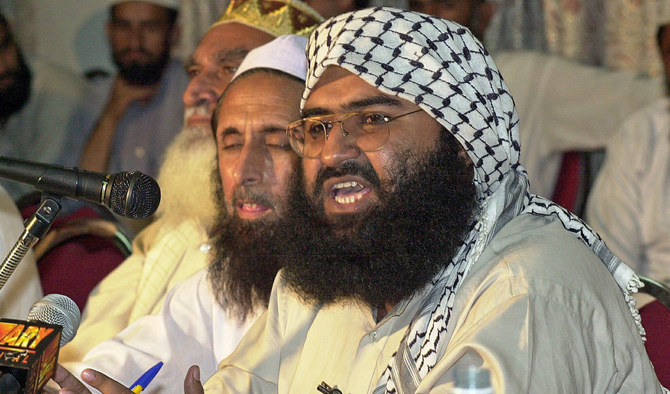 In this file photo, Masood Azhar (R), chief of religious party Jaish-e-Mohammed, addresses a meeting of Pakistan’s religious and political parties in Islamabad, 26 Aug.26, 2001. (AFP/FILE)