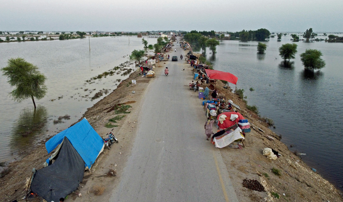 This aerial photograph taken on September 5, 2022 shows the makeshift tents of internally displaced flood-affected people after heavy monsoon rains at Dera Allah Yar town in Jaffarabad district of Balochistan province. (AFP/File)