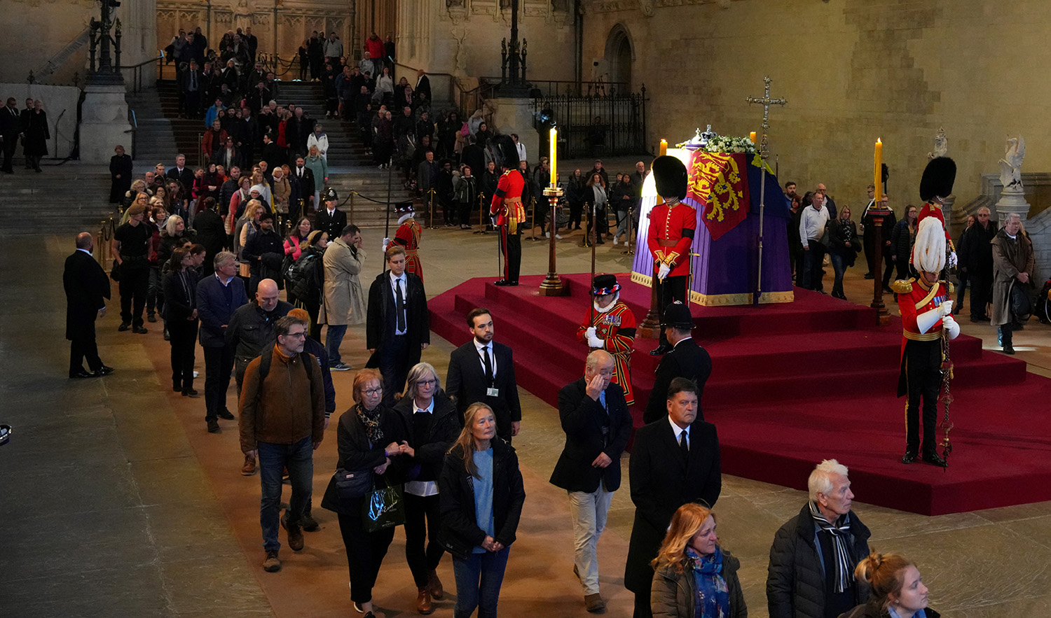 Members of the public file past the coffin of Queen Elizabeth II, draped in the Royal Standard with the Imperial State Crown and the Sovereign's orb and sceptre, lying in state on the catafalque in Westminster Hall, at the Palace of Westminster on September 17, 2022 in London, England. (Pool via REUTERS)