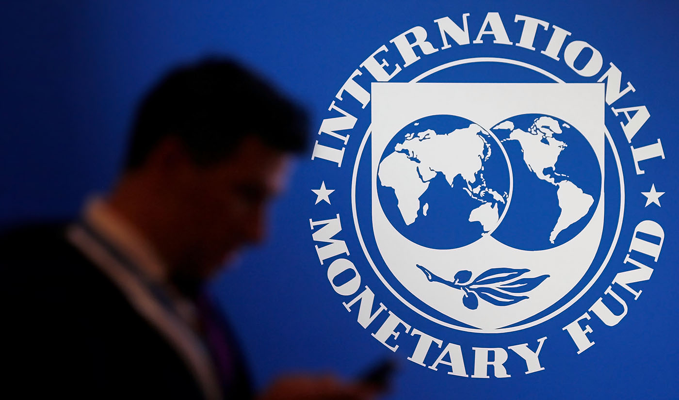 A participant stands near a logo of IMF at the International Monetary Fund - World Bank Annual Meeting 2018 in Nusa Dua, Bali, Indonesia, on October 12, 2018. (REUTERS/File)