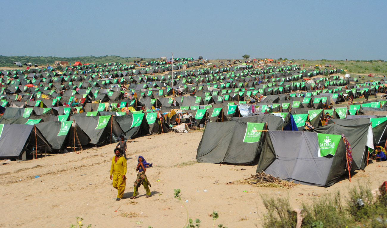 Internally displaced people take refuge at a makeshift camp in Pakistan's flood-hit Chachro of Sindh province on September 19, 2022. (AFP)