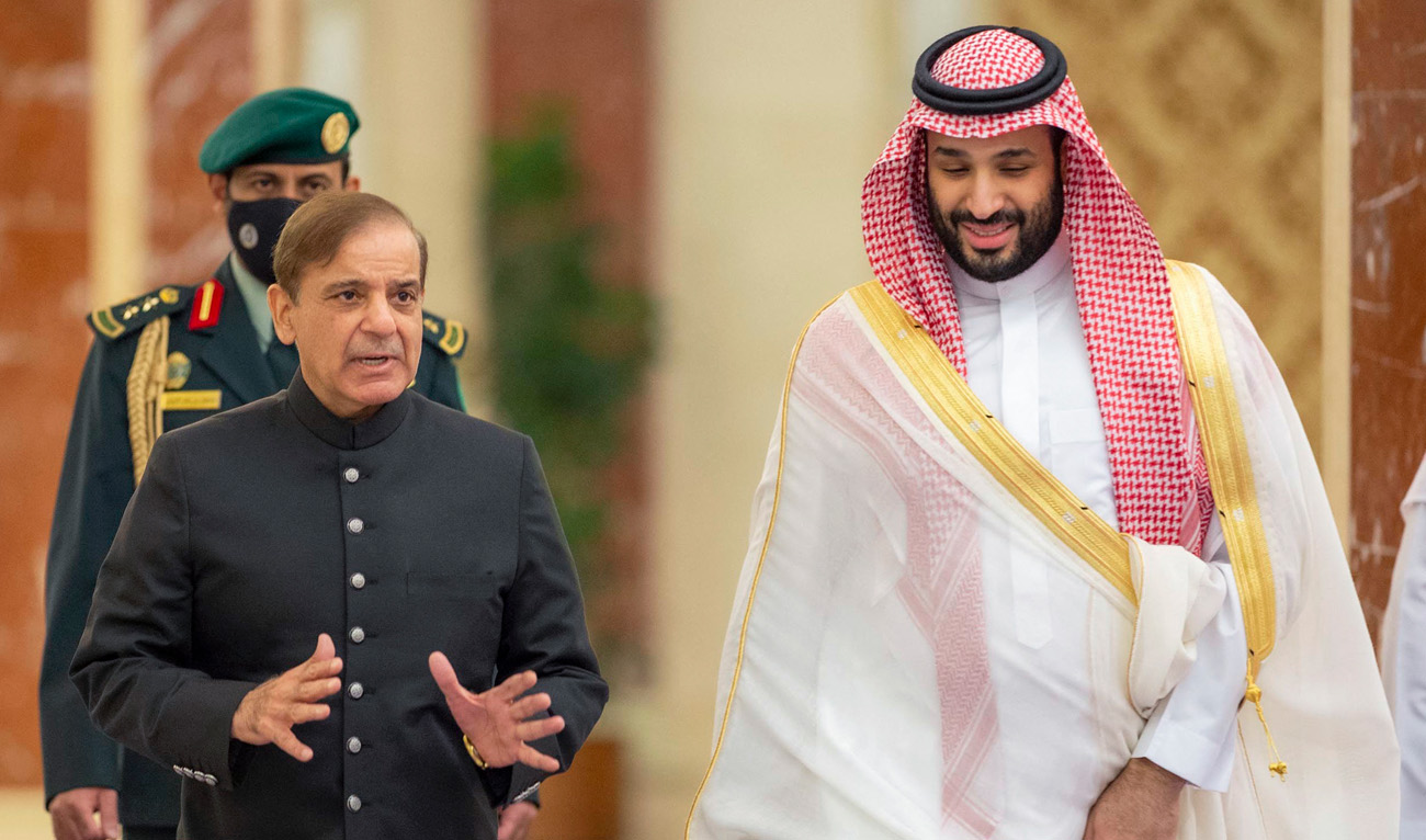 A handout picture provided by the Saudi Royal Palace shows Saudi Arabia's Crown Prince Mohammed Bin Salman (R) welcoming Pakistani Prime Minister Shehbaz Sharif in Jeddah on April 30, 2022. (AFP/File)