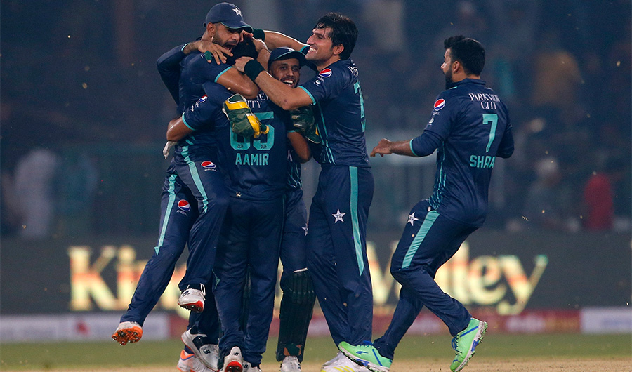 Pakistani players celebrate after winning the fifth twenty20 cricket match against England, in Lahore, Pakistan, Wednesday, Sept. 28, 2022. (AP)