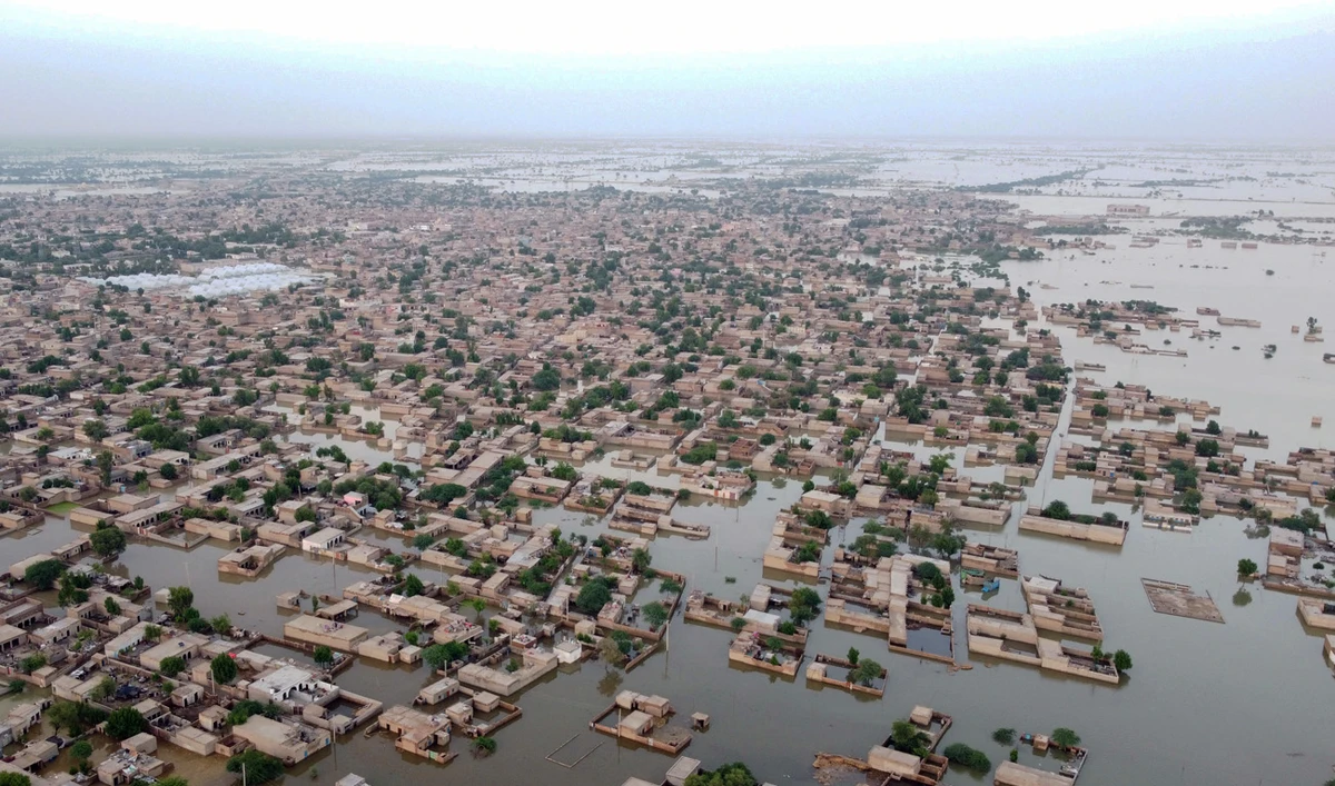 This aerial photograph taken on September 1, 2022 shows flooded residential areas after heavy monsoon rains in Dera Allah Yar town of Jaffarabad district, Balochistan province. (AFP)