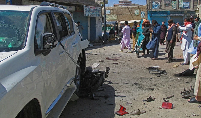 Police and residents gather at the site after a bomb blast in the Pakistan-Afghanistan border town of Chaman, Pakistan, on May 21, 2021. (REUTERS/FILE)