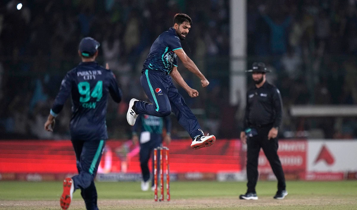 Pakistan's Harif Rauf, center, jumps to celebrate after taking the wicket of England's Olly Stone during the fourth twenty20 cricket match between Pakistan and England, in Karachi, Pakistan, on September 25, 2022. (AP)