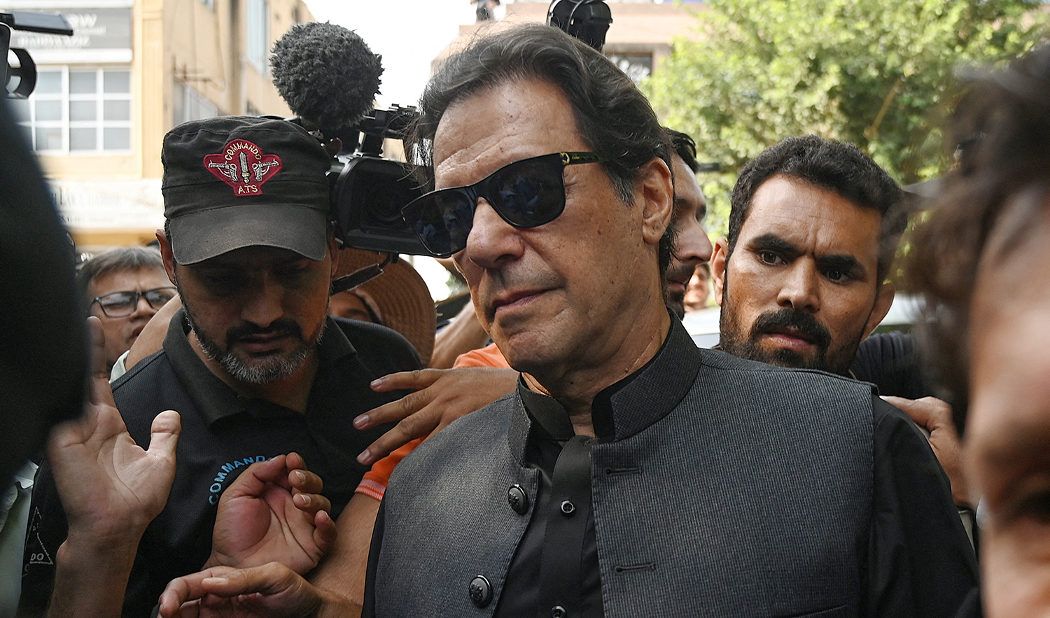 Pakistan's former Prime Minister Imran Khan, center, arrives to appear before the High Court in Islamabad on September 22, 2022. (AFP)