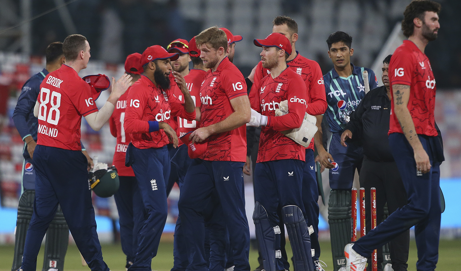 England's players congratulate each other after winning the seventh twenty20 cricket match against Pakistan, in Lahore, Pakistan, on October 2, 2022. (AP)