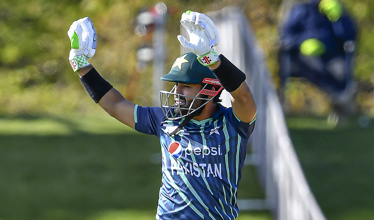 Pakistan's Mohammad Rizwan celebrates after scoring half century (50 runs) during the first match between Pakistan and Bangladesh in the Twenty20 tri-series at Hagley Oval in Christchurch on October 7, 2022. (AFP)