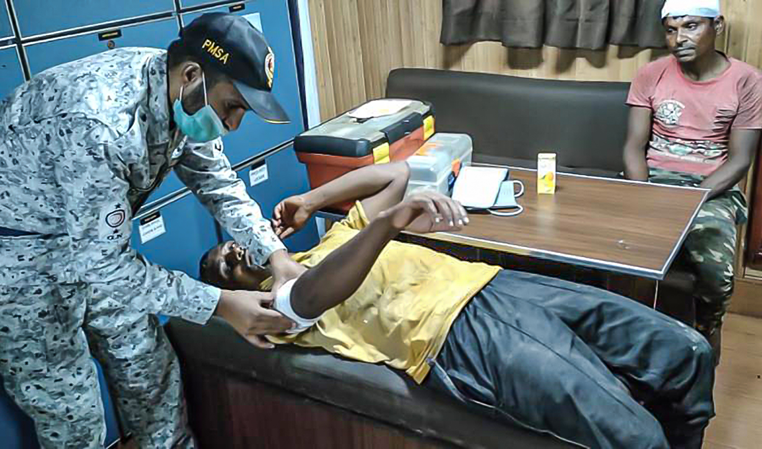 Pakistan Maritime Security providing first aid to Indian fisherman after they were rescued from drowning close to maritime boundary line between India and Pakistan on October 7, 2022. (Photo courtesy: @HqPmsa/Twitter)
