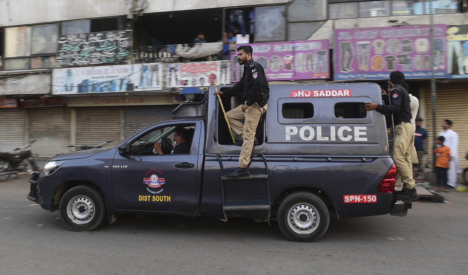 Police patrol in a market area in Karachi, Pakistan, on May 24, 2021. (AFP/File)