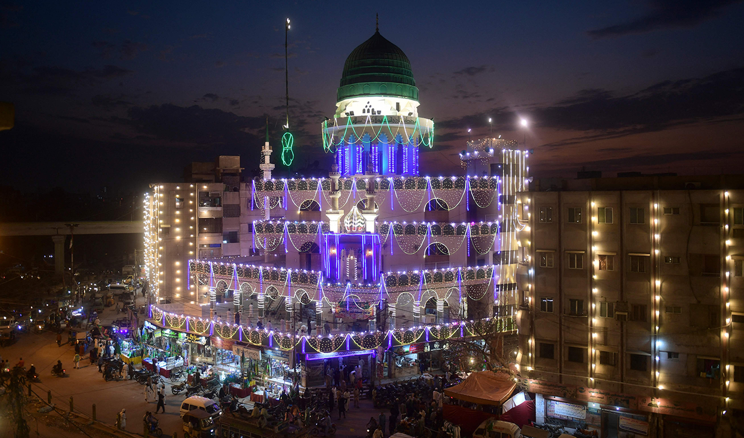 A general view shows an illuminated mosque ahead of celebrations for Eid Milad-un-Nabi, the birthday of Prophet Mohammad (PBUH), in Pakistan's port city of Karachi on October 7, 2022. (AFP)