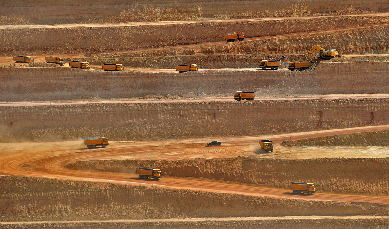 This picture taken on May 23, 2018 shows trucks transporting soil in an open-pit coal mining site at Islamkot in the desert in the Tharparkar district of Pakistan's southern Sindh province. (AFP/File)