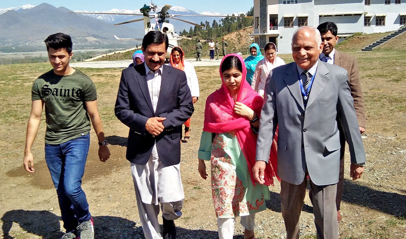 Pakistani activist and Nobel Peace Prize laureate Malala Yousafzai (C), arrives along with her father Ziauddin Yousafzai (2L), brother Atal Yousafzai (L) and the principal of all-boys Swat Cadet College Guli Bagh, during her hometown visit on March 31, 2018. (AFP/File)