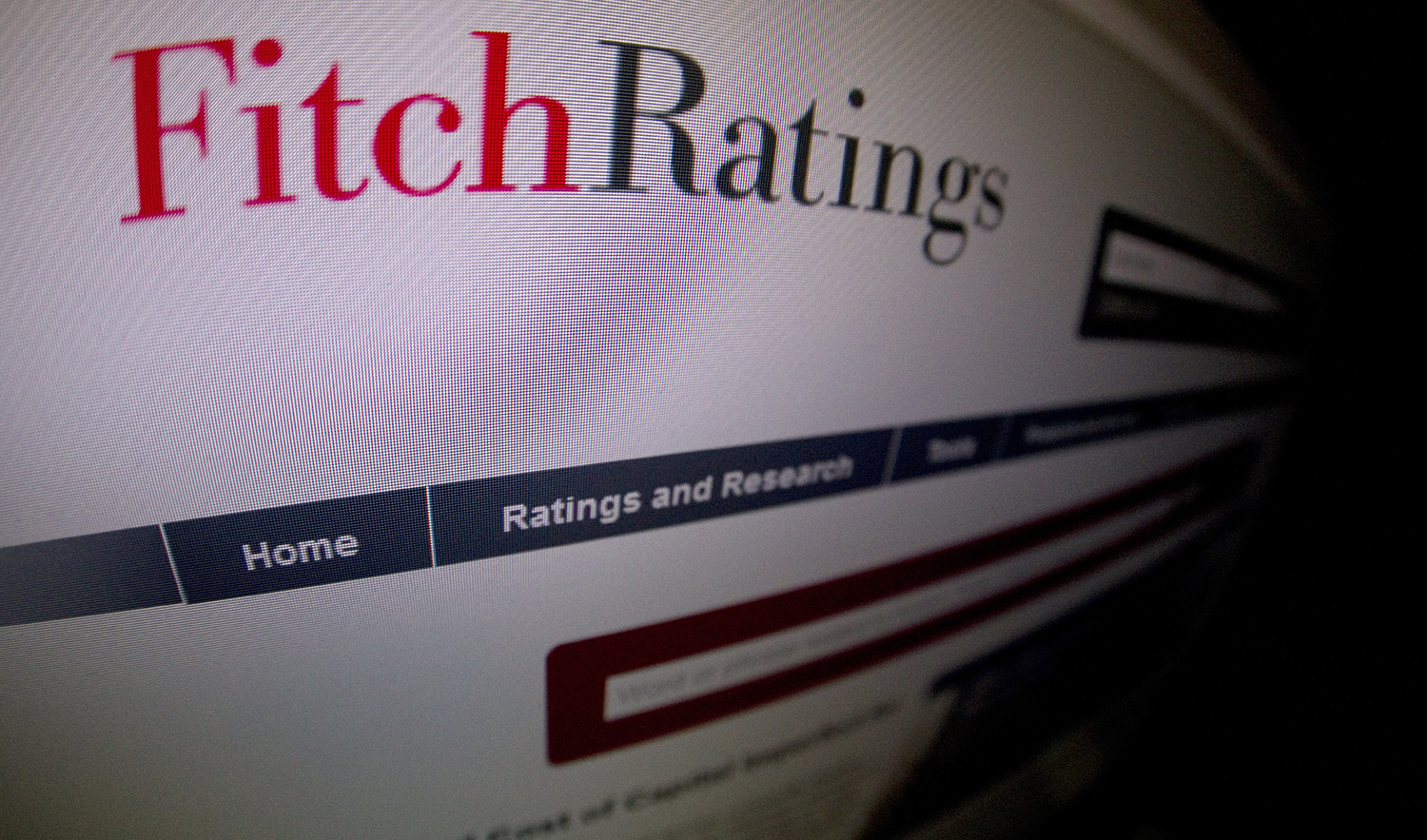 This picture taken on January 17, 2012 in Paris shows a close-up of a page of the Ratings agency Fitch website. (AFP/File)