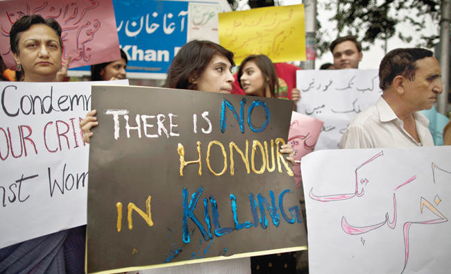 In this May 29, 2014 photo, members of Pakistan's civil society protest in Islamabad, Pakistan, to condemn the stoning to death of a woman in a case of "honor killing". (AP/FILE)
