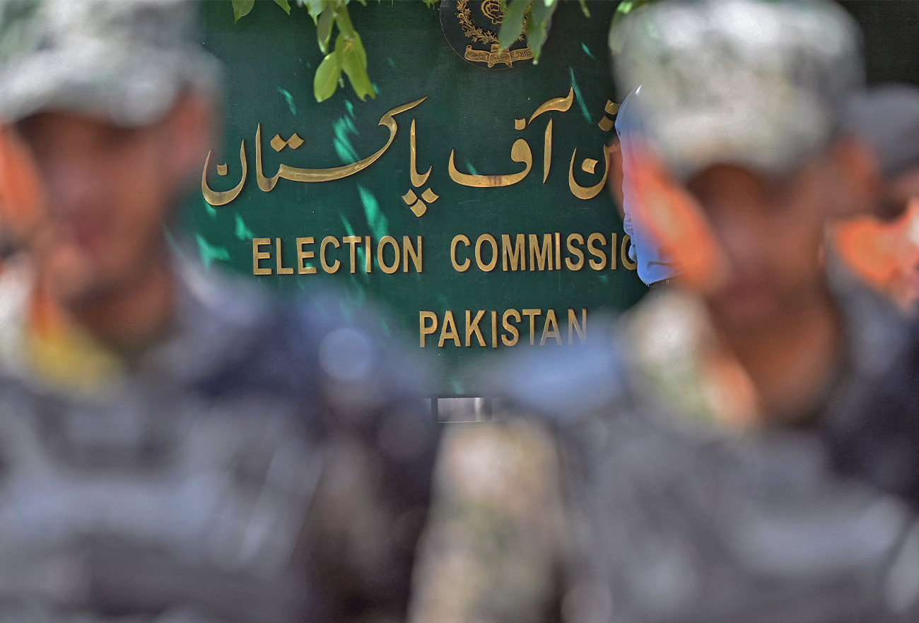 Paramilitary soldiers stand guard outside the Pakistan’s election commission building in Islamabad on August 2, 2022. (AFP/File)