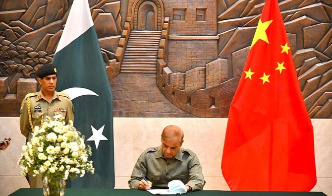Prime Minister Shahbaz Sharif writing a special message of condolence to Chinese President Xi Jinping in Islamabad on April 26, 2022. (PID/FILE)