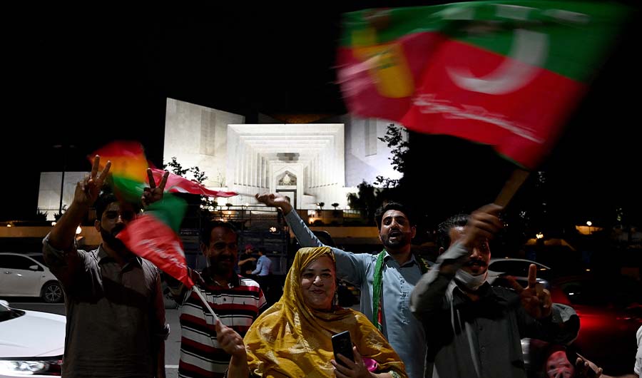Supporters of former Pakistan's Prime Minister Imran Khan celebrate in Islamabad on July 26, 2022. (AFP/FILE)